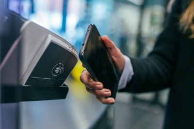 Why does the U.S. trail Asia in mobile payments adoption?